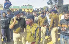  ?? HT PHOTO ?? Police officials camping in Dhani Mauji village of Churu district where four people, including a gangster, were killed in a gang war on Friday.