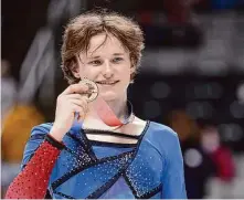  ?? Ezra Shaw/Getty Images ?? The 18-year-old Malinin poses with his gold medal after winning the U.S. men’s title, his first, at SAP Center in San Jose.
