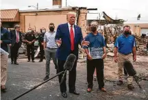  ?? Evan Vucci / Associated Press ?? President Donald Trump on Tuesday tours areas of Kenosha, Wis., damaged in protests after the shooting of Jacob Blake.