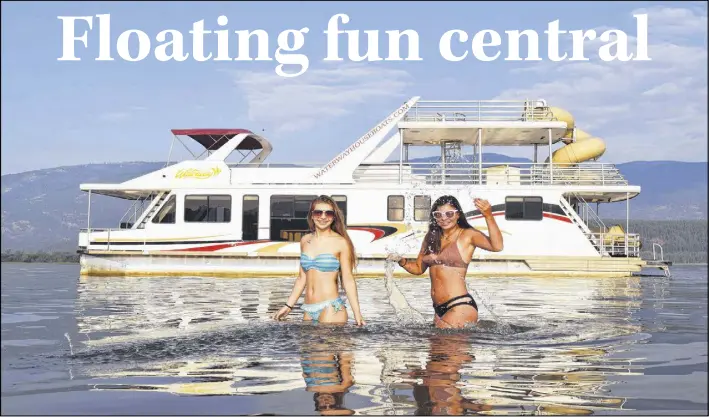  ?? STEVE MACNAULL PHOTOS ?? Lauren Hunt, left, and Grace Macnaull model in front of Amity II, our five-bedroom, two-bathroom floating luxury digs for the weekend.