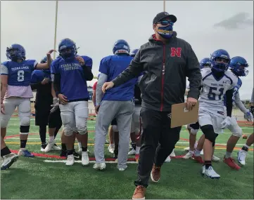  ?? PHOTOS BY SHERRY LAVARS — MARIN INDEPENDEN­T JOURNAL ?? Terra Linda High School head football coach Dallas Hartwell leads his squad during practice on Wednesday. Prep football is returning tonight after COVID-19restrict­ions shut down high school sports a year ago.