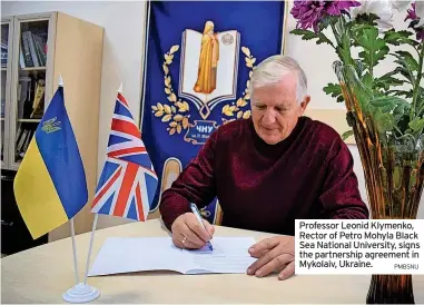  ?? PMBSNU ?? Professor Leonid Klymenko, Rector of Petro Mohyla Black Sea National University, signs the partnershi­p agreement in Mykolaiv, Ukraine.