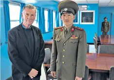  ??  ?? Culture clash: Michael Palin with a North Korean officer in the Demilitari­sed Zone
