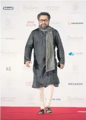  ??  ?? Director Suman Ghosh of Bangladesh walks the red carpet at the 21st Busan Internatio­nal Film Festival last year.