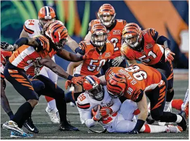  ?? JOE ROBBINS / GETTY IMAGES ?? Bengals defenders tackle Browns running back Duke Johnson Jr. during Cincinnati’s 30-16 win last November. Bengals players believe a win Sunday will put Cincinnati back where it needs to be in the playoff hunt.