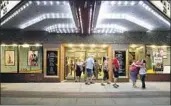  ?? Rebecca F. Miller For The Times ?? MOVIEGOERS exit the Webster Theater, which was saved by residents in Webster City, Iowa.