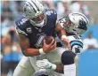  ?? BOB DONNAN/USA TODAY SPORTS ?? The Panthers sacked Cowboys quarterbac­k Dak Prescott six times in Sunday’s game.