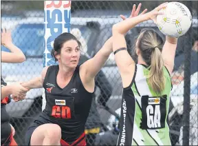  ??  ?? TEAM WORK: Brooke Pay receives a helping hand to defend Jeparitrai­nbow goalie Breanna Eastick on Saturday. The Bombers won the clash and will meet undefeated Harrow-balmoral in a mouth-watering clash at Harrow on Saturday. Picture: PAUL CARRACHER