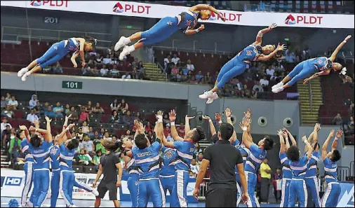  ?? JOEY MENDOZA ?? The Arellano Chiefsquad soars to the NCAA cheerleadi­ng crown, its second in three years, after foiling the defending champion Perpetual Help Perps Squad at the MOA Arena yesterday.