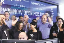  ?? Richard Drew / Associated Press ?? Upwork CEO Stephane Kasriel celebrates the Mountain View company’s successful public offering Wednesday.