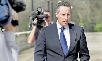  ??  ?? Ian Paisley being followed by journalist­s after he was suspended by the House of Commons for 30 sittings. This came after an inquiry committee found him guilty of not disclosing to the House his all-paid luxury trips in 2013 to Sri Lanka where he and his family stayed at presidenti­al suites of star-class hotels. Picture Courtesy The Irish News