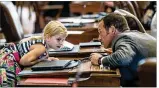  ?? TAMIR KALIFA / AMERICANST­ATESMAN ?? Rep. Jason Isaac, R-Dripping Springs, chats with Jade Honko, 7, on the House floor Tuesday.