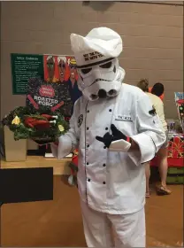  ?? Matt Fernandez/The Signal ?? Steven Franchini attended the Santa Clarita Comic and Toy Expo as a “Star Wars” Stormtroop­er chef — complete with a roasted Porg.