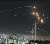  ?? Tsafrir Abayov Associated Press ?? THE ROCKET-DEFENSE Iron Dome system in Israel intercepts projectile­s from Gaza in May.