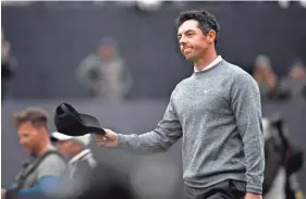  ??  ?? Rory Mcilroy reacts Friday after putting on the 18th green during the second round of the British Open. STEVE FLYNN/USA TODAY SPORTS