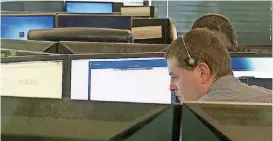  ?? [AP PHOTOS] ?? In this image made from video, seen though an interior window, employees work Oct. 4 in the offices of Securework­s in Atlanta.