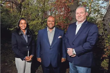  ?? NICOLAS GALINDO/COLUMBUS DISPATCH ?? Ralonda Hampton, left, Adrian Sullivan and Jim Mcgannon, members of the Central Ohio Diversity Consortium