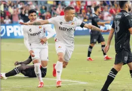  ?? PHOTO BY RAUL ROMERO JR. ?? Jonathan Rodríguez of Cruz Azul, center, reacts after scoring a goal against the MLS All-Stars during Wednesday night’s MLS All-Star Game at Banc of California Stadium.