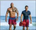  ?? FRANK MASI — PARAMOUNT PICTURES VIA AP ?? This image released by Paramount Pictures shows Dwayne Johnson as Mitch Buchannon, left, and Zac Efron as Matt Brody in “Baywatch.”