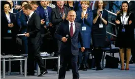  ?? MAXIM SHIPENKOV / POOL PHOTO VIA AP ?? President Vladimir Putin prepares to answer a question Saturday at the United Russia party congress in Moscow. He pledged to offffer broader incentives for business, fifight corruption and pour resources into health care and education.