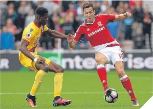  ??  ?? Boro’s Stewart Downing (right) is challenged by with Palace’s Wilfried Zaha.