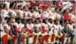  ?? RICK SCUTERI - THE ASSOCIATED PRESS ?? Members of the San Francisco 49ers kneel during the national anthem as others stand during the first half of an NFL football game against the Arizona Cardinals on Sunday.