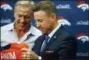  ?? DAVID ZALUBOWSKI — THE ASSOCIATED PRESS ?? Case Keenum, front, admires his new jersey as John Elway, general manager of the Denver Broncos, looks on during a news conference to introduce him as the new starting quarterbac­k of the Broncos at the NFL football team’s headquarte­rs Friday in...