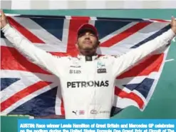  ??  ?? AUSTIN: Race winner Lewis Hamilton of Great Britain and Mercedes GP celebrates on the podium during the United States Formula One Grand Prix at Circuit of The Americas in Austin, Texas.