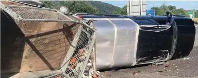  ??  ?? Richard Smith’s truck and trailer turned over in the accident on the Heads of the Valleys road