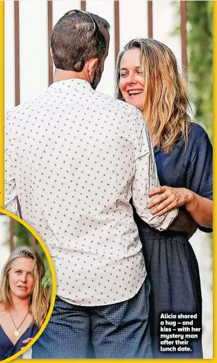  ??  ?? Alicia shared a hug – and kiss – with her mystery man after their lunch date.