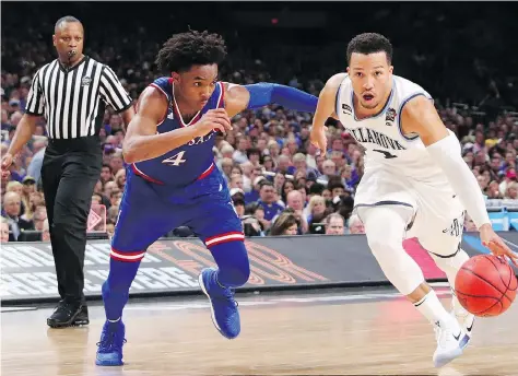  ?? TOM PENNINGTON/GETTY IMAGES ?? Villanova University Wildcats guard Jalen Brunson, right, is defended by the University of Kansas Jayhawks guard Devonte’ Graham in the second half of their NCAA Final Four semifinal Saturday in San Antonio. Bruson had 18 points and six assists in a...