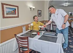  ?? ?? g Service with a song: chef and co-owner James Rusden gives Gavin his breakfast