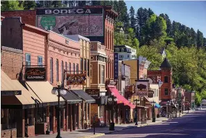  ?? Photos courtesy South Dakota
Department of Tourism ?? bottom right Historic Deadwood: Walk in the footsteps of historic Old West legends like Wild Bill Hickok, Calamity Jane and Seth Bullock. This 1870s gold rush town became a National Historic Landmark in 1961. Today, it teems with Black Hills entertainm­ent and things to do includingc­oncerts, casinos, museums, historic sites, spas and parades. The race for gold raised a mountain town to its feet for a colorful traipse through history. Grit, determinat­ion and legendary characters entrenched this landmarkci­ty in the lore of the American West.