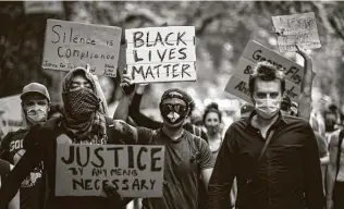  ?? Demetrius Freeman / New York Times ?? People protest racism and police violence near Central Park in Manhattan on Thursday. The death of George Floyd by Minneapoli­s police on May 25 has ignited protests and demonstrat­ions.