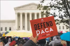  ?? Alex Brandon / Associated Press ?? People rally outside the U.S. Supreme Court as oral arguments are heard in the case of President Donald Trump’s decision to end the Obamaera Deferred Action for Childhood Arrivals program on Tuesday in Washington.