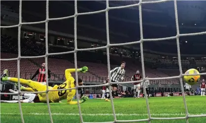 ?? Photograph: Miguel Medina/AFP/ Getty Images ?? Federico Chiesa fires his effort past Milan’s goalkeeper Gianluigi Donnarumma to open the scoring.