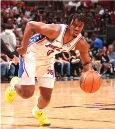  ?? — AFP photo ?? Maxey handles the ball during the game against the Miami Heat.