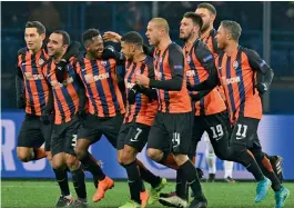  ?? — AFP ?? Shakhtar Donetsk’s Fred ( third from left) celebrates after scoring in their round of 16 first leg match against AS Roma at the OSK Metalist Stadion in Kharkiv on Wednesday. Shakhtar won 2- 1.