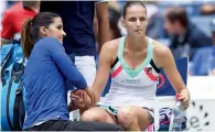  ?? AFP ?? Karolina Pliskova receives assistance during her match against Shuai Zhang. —