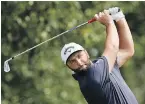  ?? THE ASSOCIATED PRESS ?? Jon Rahm hits from the tee box on the third hole during second round play at East Lake Golf Club on Friday.