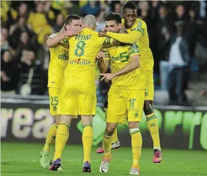  ?? | PHOTO : ARCHIVES OUEST-FRANCE ?? La joie de Djordjevic, Bessat, Veretout et Birama Touré lors du succès 1-0 contre Sedan en mai 2013 qui offre la montée en L1 aux Canaris.