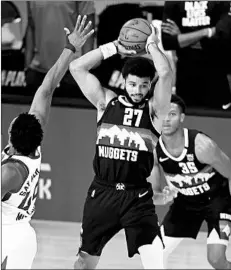  ?? MIKE EHRMANN/GETTY ?? Jamal Murray scored 33 of his 42 points in the second half Tuesday night.