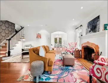  ?? Contribute­d by Sotheby’s Internatio­nal Realty ?? The living room at 45 Lockwood Lane has a wood-burning fireplace. It opens to both the dining room and family room.