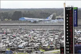  ?? DAVID GRAHAM / AP ?? Air Force One touches down at the Daytona Beach Internatio­nal’s Airport as President Donald Trump makes his arrival to attend the NASCAR Daytona 500 auto race on Sunday in Daytona Beach, Fla.