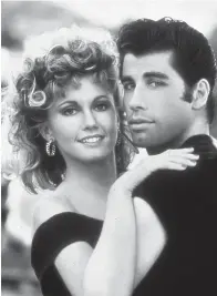  ?? Tribune News Service ?? ■ Olivia Newton-John (left) and John Travolta costar in the classic musical, “Grease,” which is celebratin­g its 40th birthday on Saturday. REELZ is offering a behind-the-scenes look at the film, “‘Grease’: Behind Closed Doors” on Saturday.