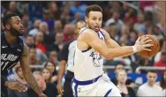  ?? RICARDO RAMIREZ BUXEDA/TRIBUNE NEWS SERVICE ?? Orlando Magic's Jonathon Simmons, left, defends Golden State Warriors guard Stephen Curry in Orlando on Friday.