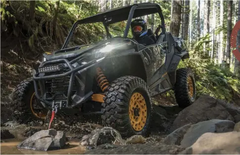  ??  ?? This Can-Am Commander XT-P is at home in the roks and
mud.