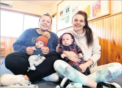  ??  ?? BACK IN ACTION: Sally Russell with Oliver Whitehead, three months, and Jayde Reynen with Ned, four months, participat­e in a supported playgroup session in Horsham. The program has resumed face-to-face sessions. Picture: PAUL CARRACHER