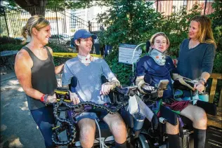  ?? PHIL SKINNER FOR THE AJC ?? Kristen O’brien (from left), her son Britt, Julian Stanford and mother Jennifer chat at the Shepherd Center. The two mothers met at the center where their boys are patients after being paralyzed from recent accidents. Because of COVID-19, the situation has been made extra difficult.