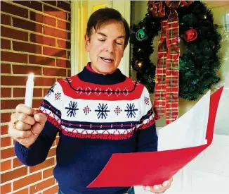  ?? ANN HARDIE FOR THE AJC ?? Bob Gibeling leads a group that has been caroling in Atlanta’s Garden Hills neighborho­od for 25 years.